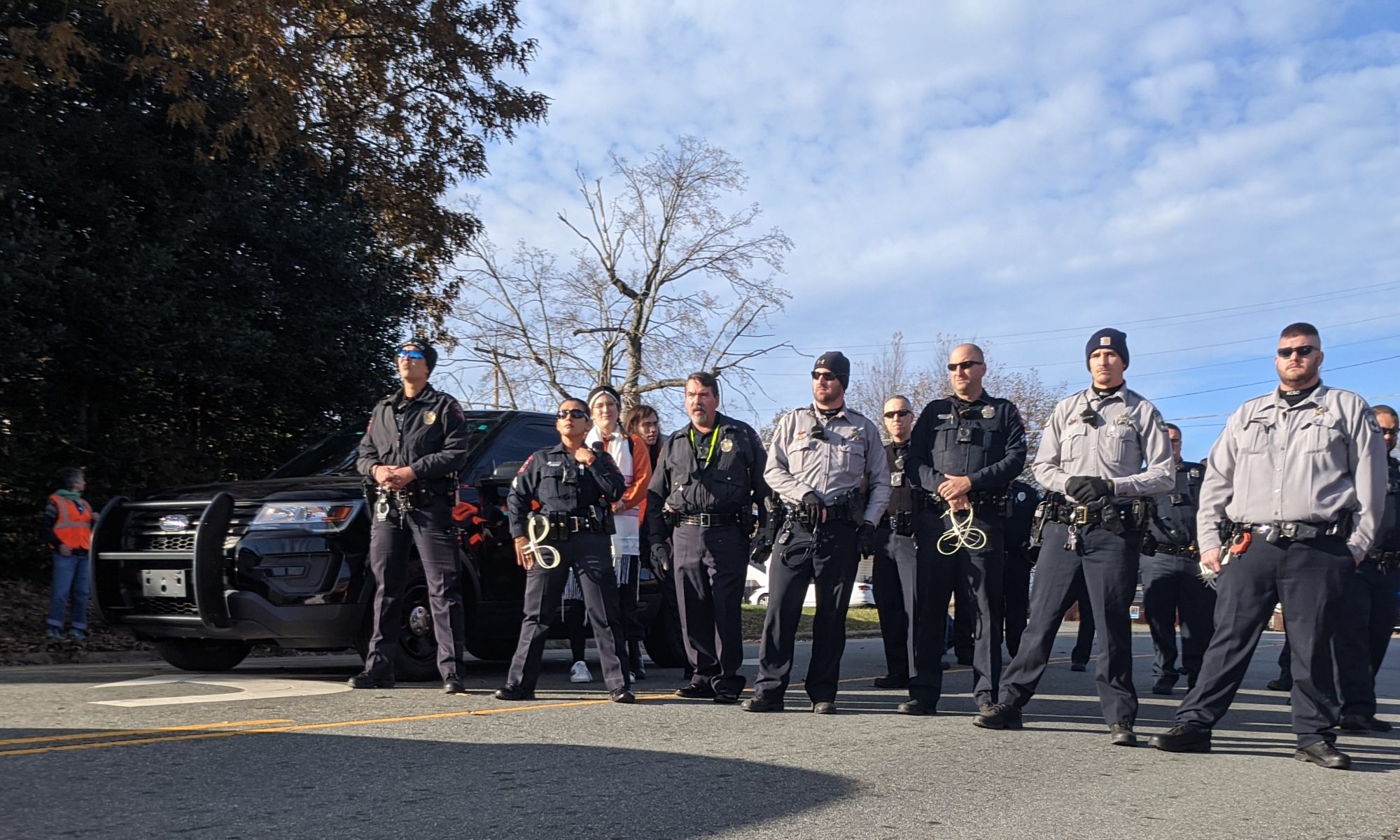 Line of Police Blocking Street