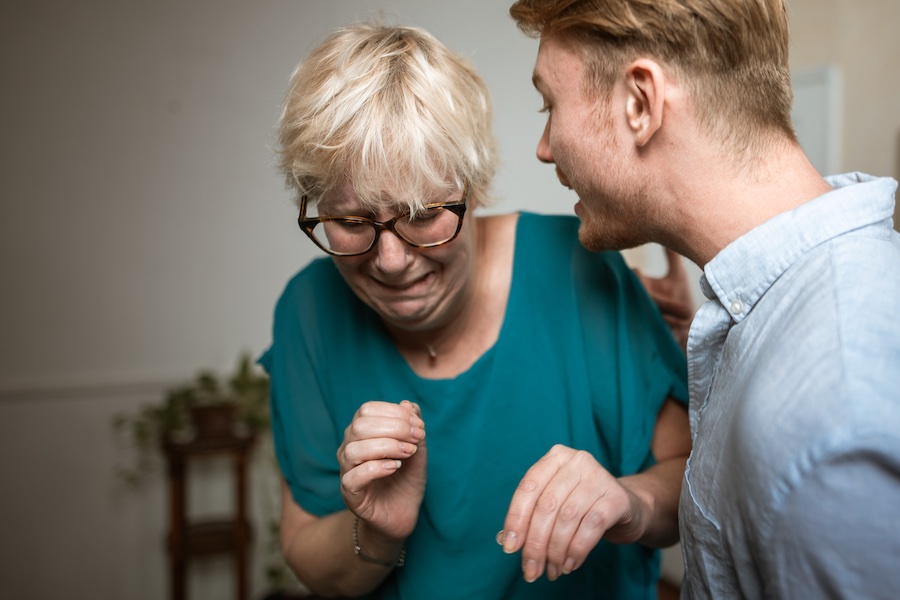 Image of a man verbally abusing a woman